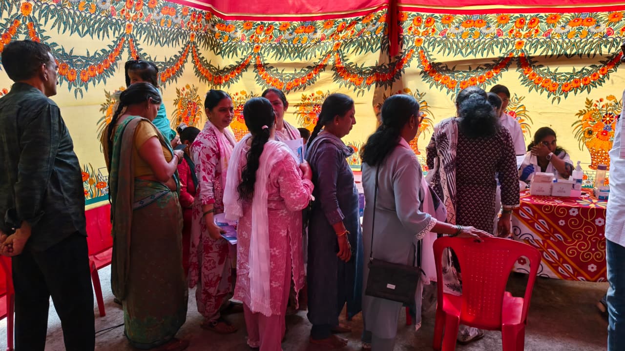 Women queuing for screening at the community health camp